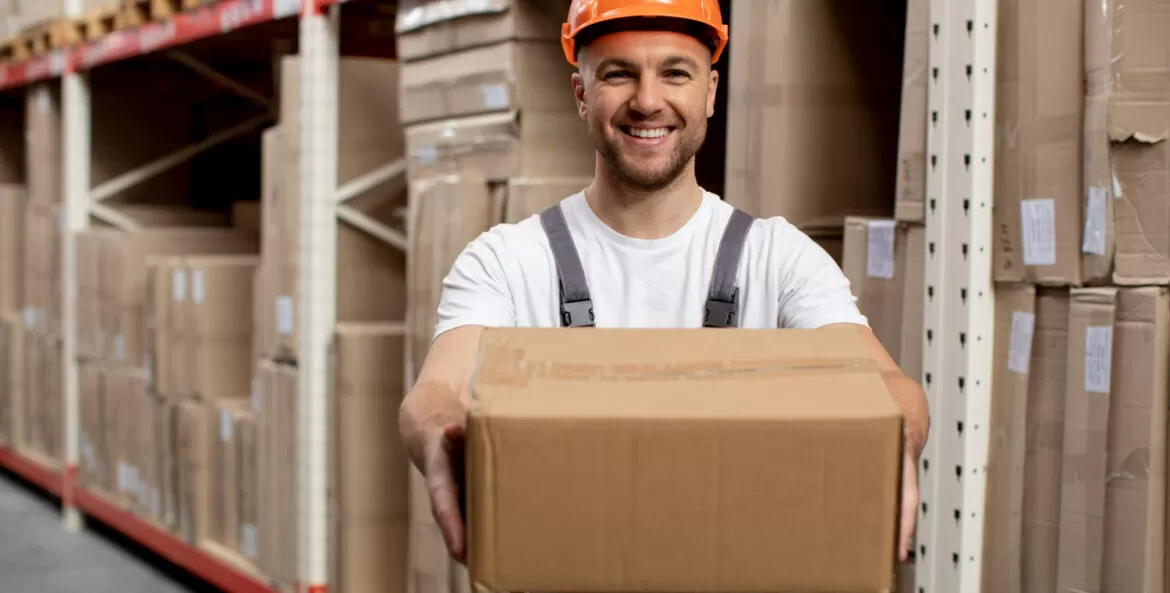 medium shot smiley man holding box